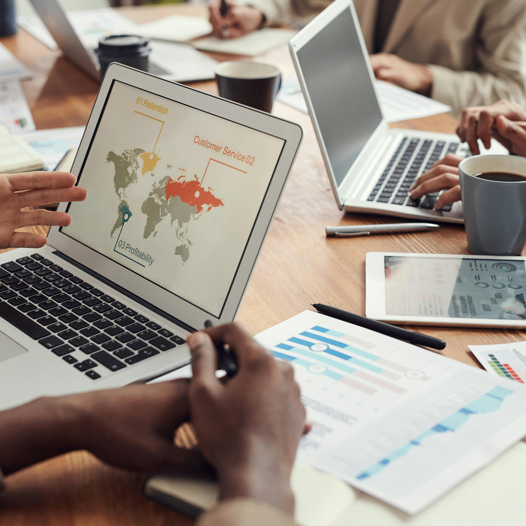 business owners reviewing metrics on their laptops.